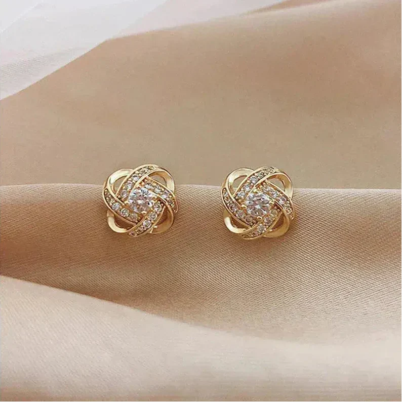Boucles d'Oreilles Spirales Dorées avec Cristaux