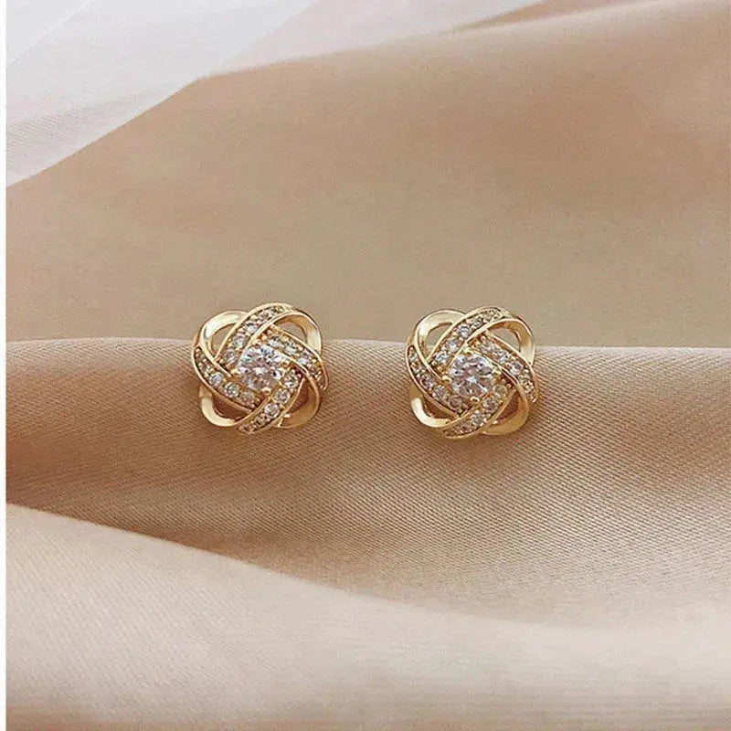 Boucles d'Oreilles Spirales Dorées avec Cristaux