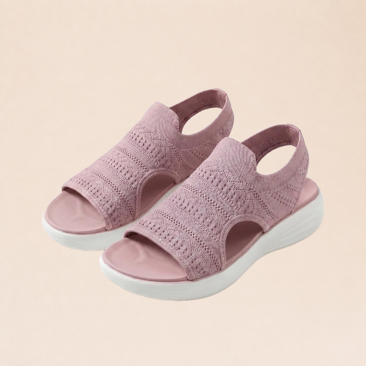 Sandales orthopédiques roses sur fond beige